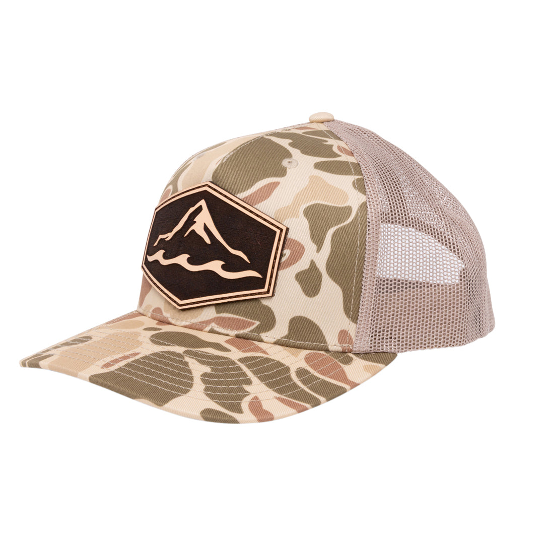 Camo branded trucker hat with genuine leather patch