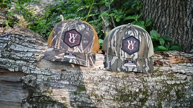 Camo branded trucker hat with dye-sublimated Compass patch