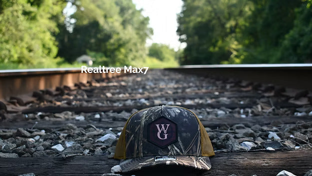 Camo branded trucker hat with dye-sublimated Compass patch