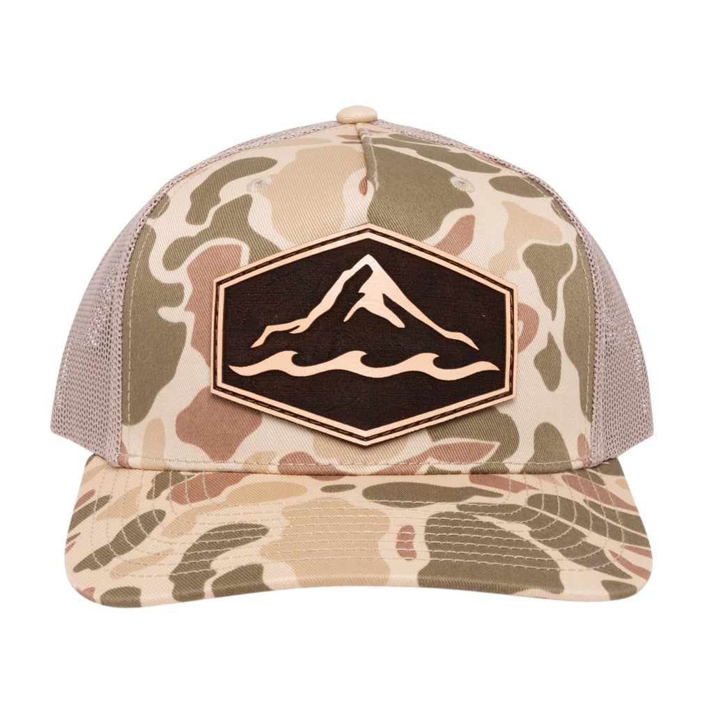 Camo branded trucker hat with genuine leather patch
